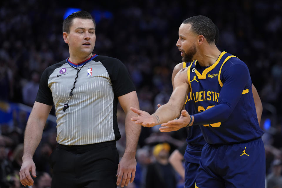 Stephen Curry was ejected late Wednesday after he threw his mouthguard into the stands while reacting to a Jordan Poole shot. (AP/Godofredo A. Vásquez)