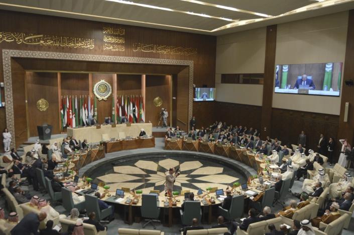 In this photo released by Egypt's Ministry of Foreign Affairs, delegates and foreign ministers of member states convene at the Arab League headquarters in Cairo, Egypt, Sunday, May 7, 2023. The ministers are voting on restoring Syria's membership to the organization after it was suspended over a decade ago. The meeting comes after a rapid rapprochement between Syria and regional governments since February. (Egyptian Ministry of Foreign Affairs via AP)