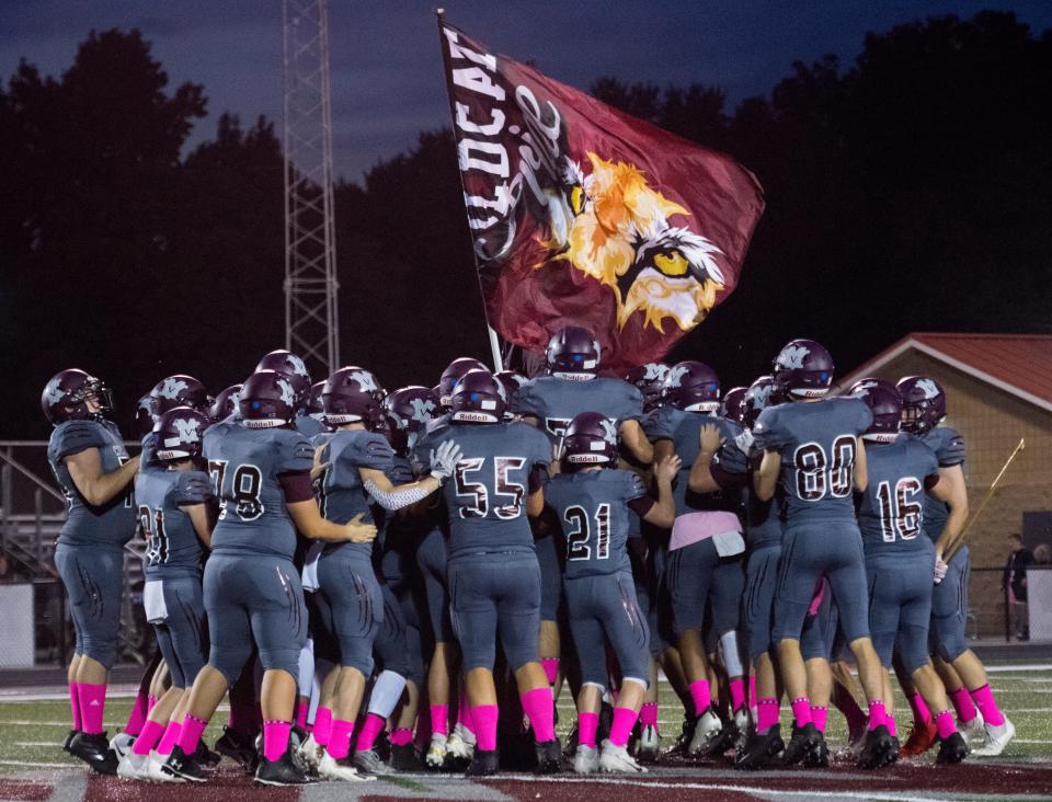 The Mt. Vernon Wildcats gather ahead of their game against the Gibson Southern Titans in Mt. Vernon, Ind., Friday evening, Oct. 1, 2021. 