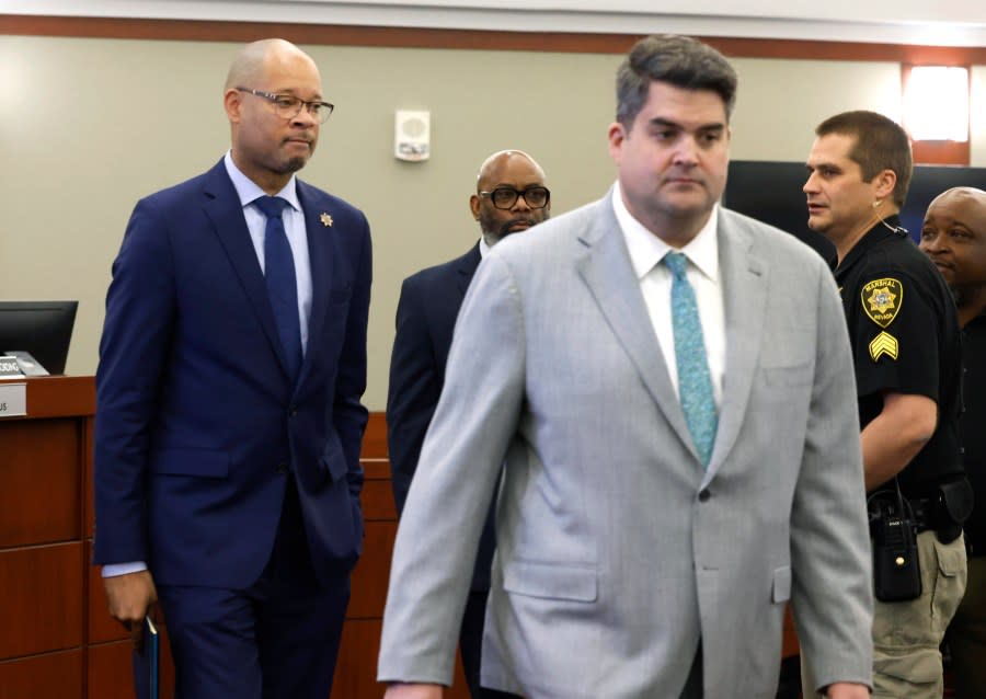 FILE – Nevada’s Attorney General Aaron Ford, left, and Matthew Rashbrook, a special prosecutor, enter the courtroom where Nevada Republicans accused in a fake elector scheme are being arraigned on Dec. 18, 2023, in Las Vegas. (Bizuayehu Tesfaye/Las Vegas Review-Journal via AP, File)