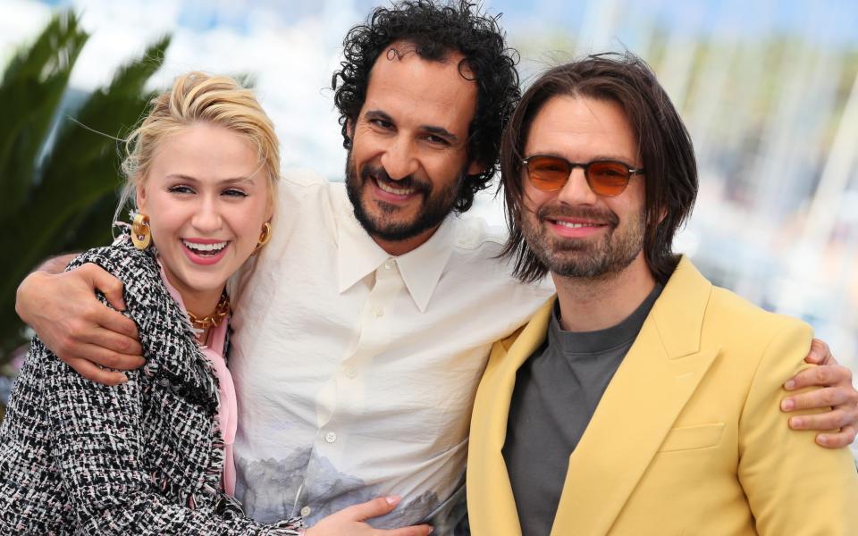 Maria Bakalova, director Ali Abbasi and Sebastian Stan promoting The Apprentice in Cannes