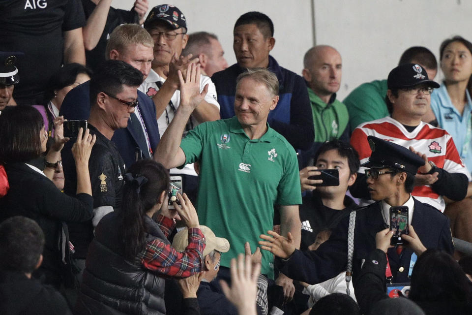 Ireland coach Joe Schmidt waves fans after the Rugby World Cup quarterfinal match at Tokyo Stadium between New Zealand and Ireland in Tokyo, Japan, Saturday, Oct. 19, 2019. (AP Photo/Mark Baker)