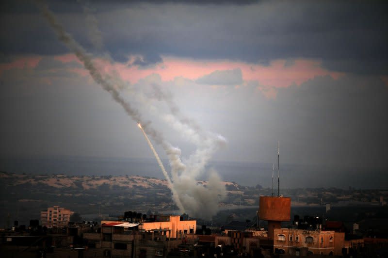 Rockets are shown being launched from the southern Gaza Strip towards Israel on Saturday. Israel declared it is 'at war' with Hamas militants after at least 40 were killed in a barrage that included thousands of rockets. Photo by Ismael Mohamad/UPI