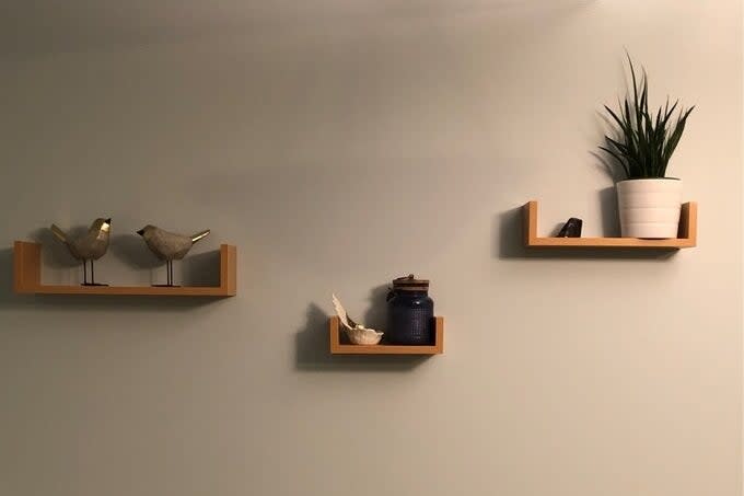 Reviewer image of the shelves on their wall with knickknacks displayed