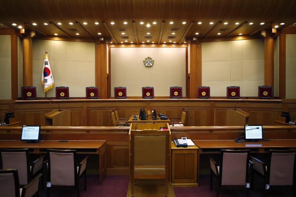 An empty court is seen before the first hearing arguments for South Korean President Park Geun-hye's impeachment trial at the Constitutional Court in Seoul, South Korea, Tuesday, Jan 3, 2017. (Kim Hong-Ji/Pool Photo via AP)