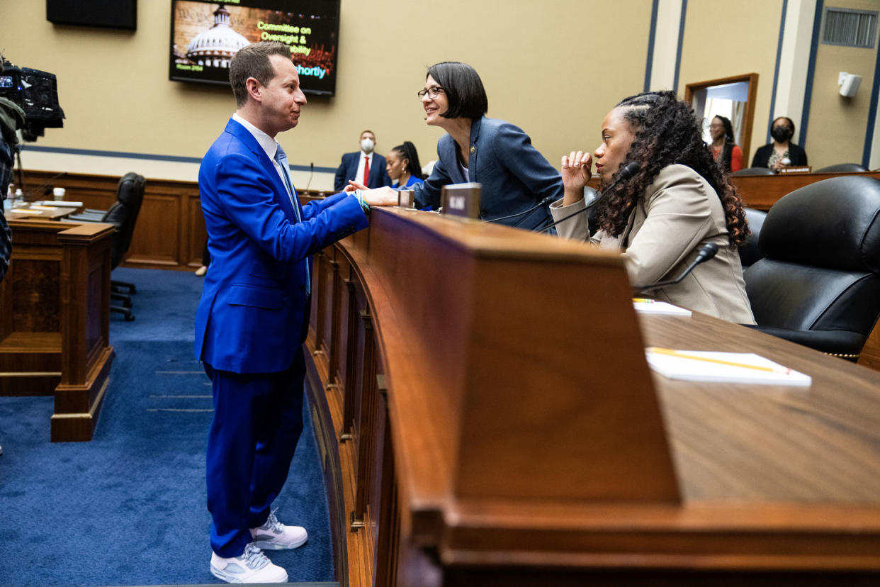 From left; Rep. Jared Moskowitz, D-Fla., talks to Becca Balint, D-Vt., and Summer Lee, D-Pa., in Washington, D.C. on May 16, 2023.  (Tom Williams / AP)