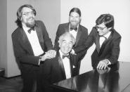 A cheerful Dave Brubeck sits as his sons Chris, left, Danny and Darius, right, surround him during an intermission at Lincoln Center's Avery Fisher Hall, Saturday, June 23, 1985, New York. (AP Photo/Richard Drew)