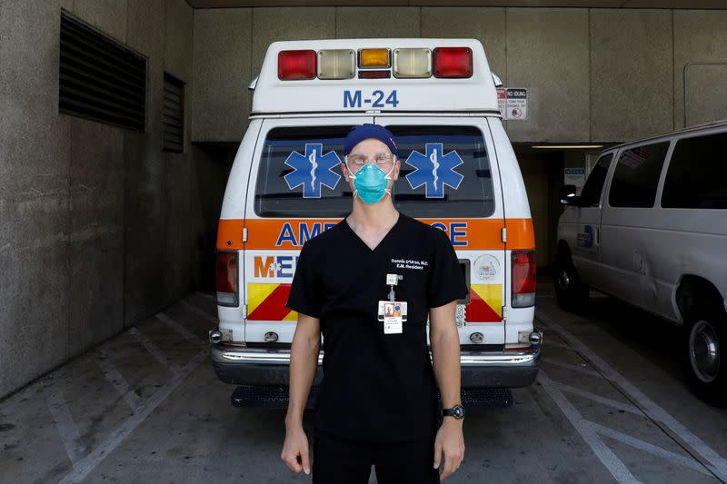 Dennis D'Urso, a resident ER doctor at Jackson Memorial Hospital, poses for a photo during his shift amid an outbreak of coronavirus disease (COVID-19), in Miami