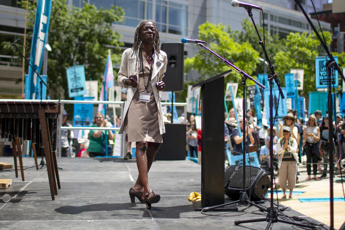 FILE - In this June 4, 2019, file photo, Portland Commissioner Jo Ann Hardesty spoke as several hundred people gathered in Director Park in Portland, Ore., at a rally in support of a climate change lawsuit .City commissioners in Portland voted Wednesday, June 17, 2020 to cut nearly $16 million from the Portland Police Bureau's budget in response to concerns about police brutality and racial injustice. The cuts are part of a city budget approved by the commissioners by a 3-1 vote in a contentious meeting. (Dave Killen/The Oregonian via AP, File)