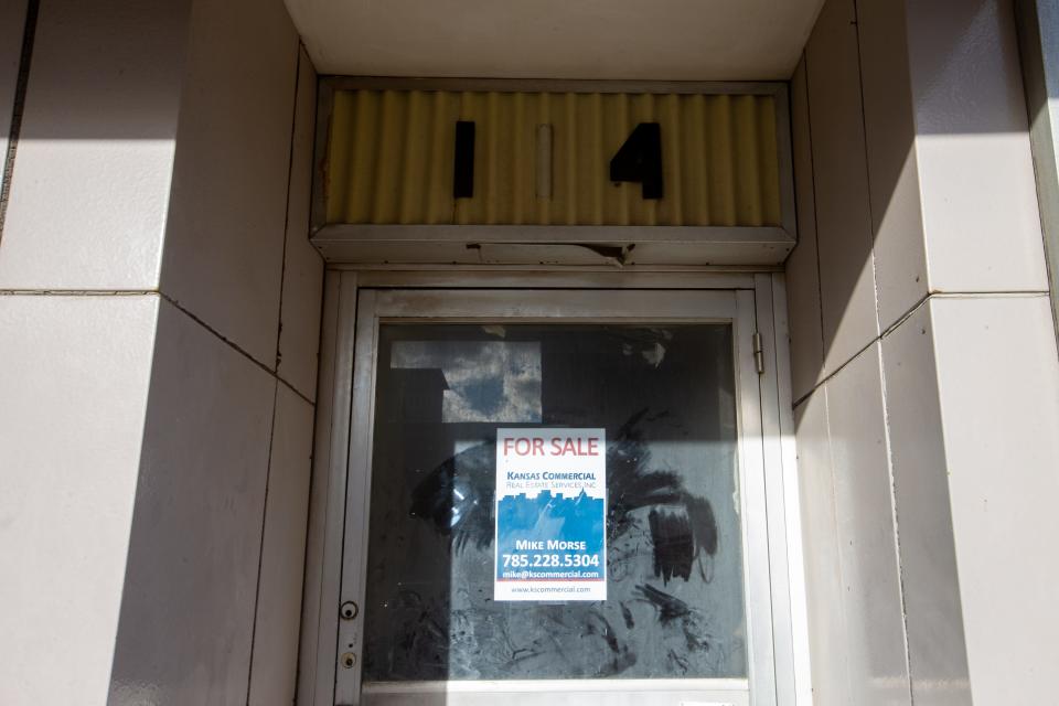 A "for sale" sign could be seen Tuesday on an aging downtown Topeka building owned a century ago by early Black Topeka newspaper editor Nick Chiles.