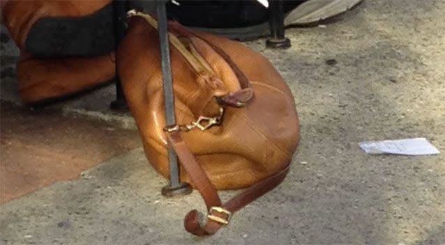 The mother had become besotted with a brown leather handbag that was lying on the ground beside the diners, which she mistook for a sleeping dachshund. Picture: Twitter/Hannah Murphy