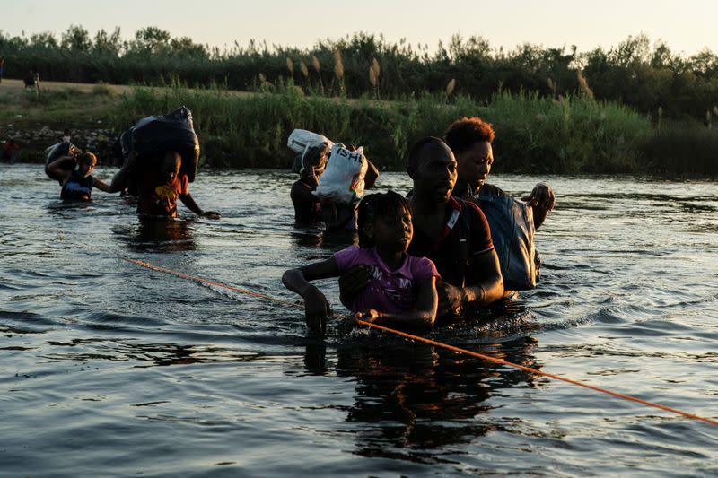 Asylum-seeking migrants in the U.S. return to Mexican side of the border, in Ciudad Acuna