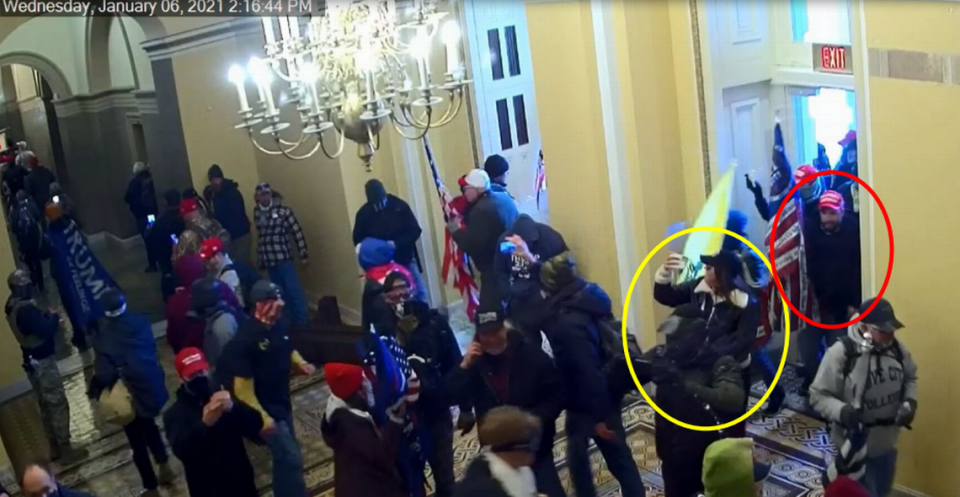 Screenshot of CCTV footage showing Barbara Balmaseda in the yellow circle, and Gabriel Garcia, a member of Proud Boys, in the red circle, entering the Capitol with a flag in one hand and cell phone in the other hand on Jan. 6, 2021.