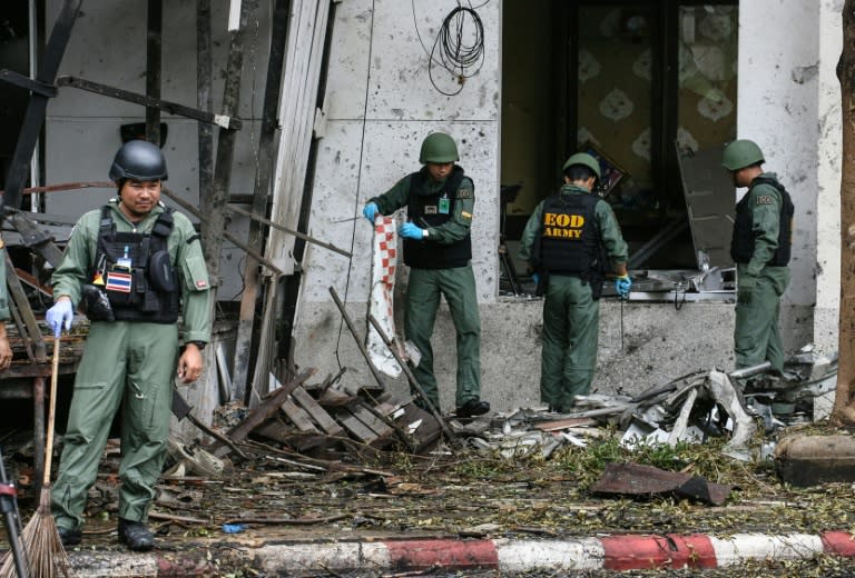 A Thai bomb squad inspects the site of a deadly bombing in the southern province of Pattani on August 24, 2016