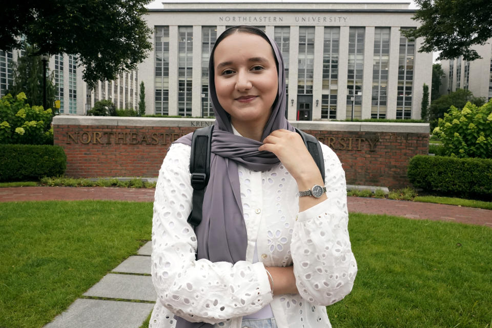 Northeastern University student Mashal Aziz poses on campus, Friday, July 21, 2023, in Boston. Aziz was just months away from graduating from college in Afghanistan when she found herself rushing to the airport to leave the country as the Taliban swept into power. Universities and colleges across the U.S. have scrambled to find ways to help students, like Aziz, to continue their education. (AP Photo/Charles Krupa)