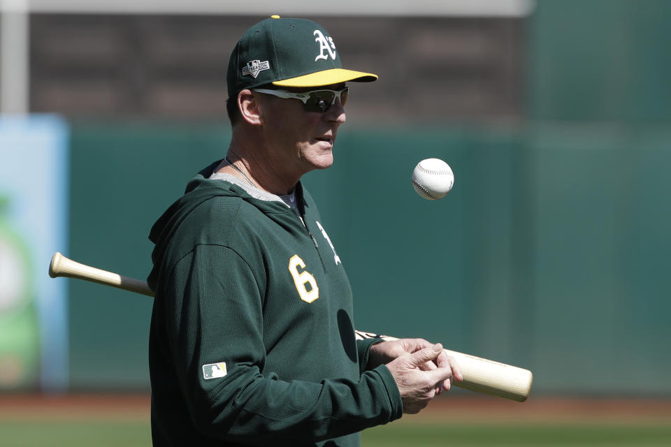 Oakland Athletics manager Bob Melvin watches baseball practice in Oakland, Calif., Tuesday, Oct. 1, 2019. The Athletics are scheduled to face the Tampa Bay Rays in an American League wild-card game Wednesday, Oct. 2. (AP Photo/Jeff Chiu)