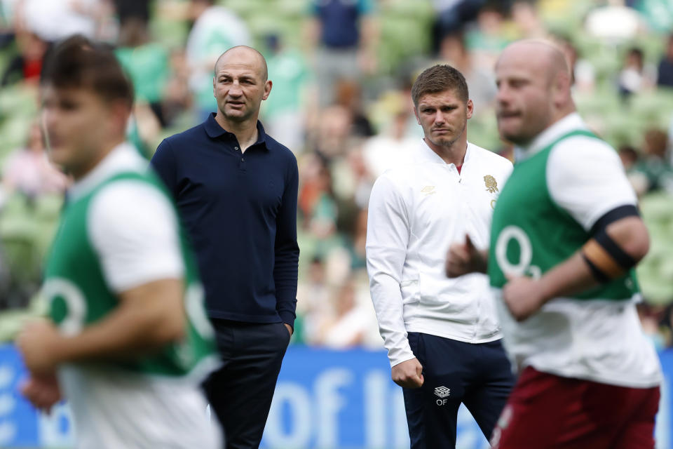 FILE - England's head coach Steve Borthwick, left, with Owen Farrell before a start for the international rugby union match between Ireland and England, at Aviva Stadium, Dublin, Ireland, on Aug. 19, 2023. Rarely has England gone into a Rugby World Cup with so little external expectation. The English have long been Europe’s big hope on the global stage and the team that most concerned the big guns from the southern hemisphere. (AP Photo/Peter Morrison, File)