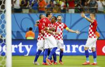 Croatia's Ivica Olic (L) celebrates his goal against Cameroon with his teammates during their 2014 World Cup Group A soccer match at the Amazonia arena in Manaus June 18, 2014. REUTERS/Murad Sezer (BRAZIL - Tags: SOCCER SPORT WORLD CUP)