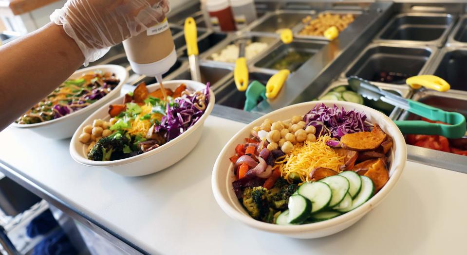 JJ's Caffe, 610 North Main St., Brockton, is back with a transformed menu of healthy options, like these salad bowls being prepared on Friday, July 1, 2022.