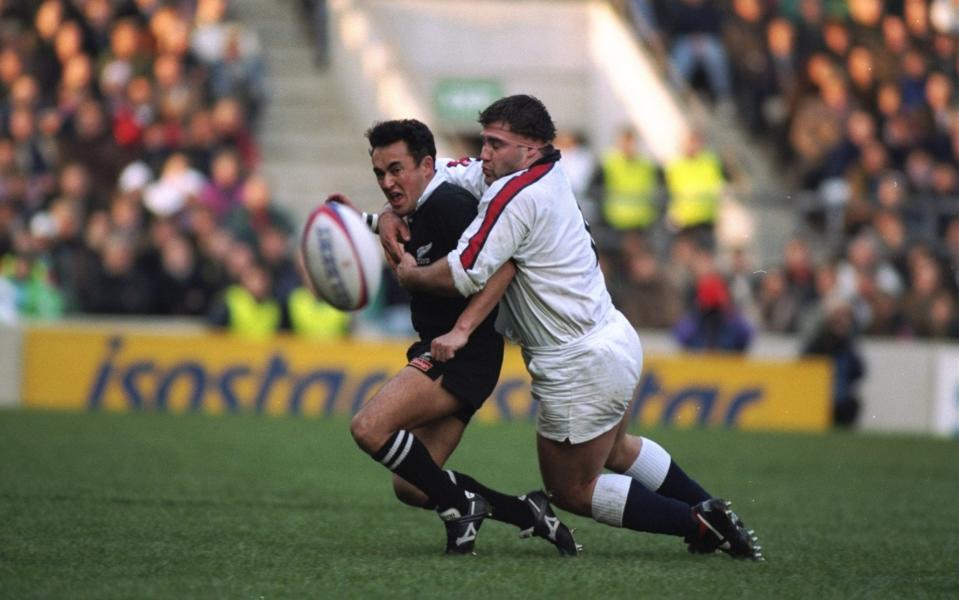 Jason Leonard (right) of England tackles Stu Forster (left) of New Zealand in 1993 - GETTY IMAGES