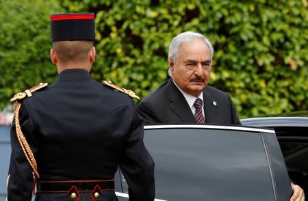 General Khalifa Haftar, commander in the Libyan National Army (LNA), arrives to attend a meeting for talks over a political deal to help end Libya’s crisis in La Celle-Saint-Cloud near Paris, France, July 25, 2017. REUTERS/Philippe Wojazer