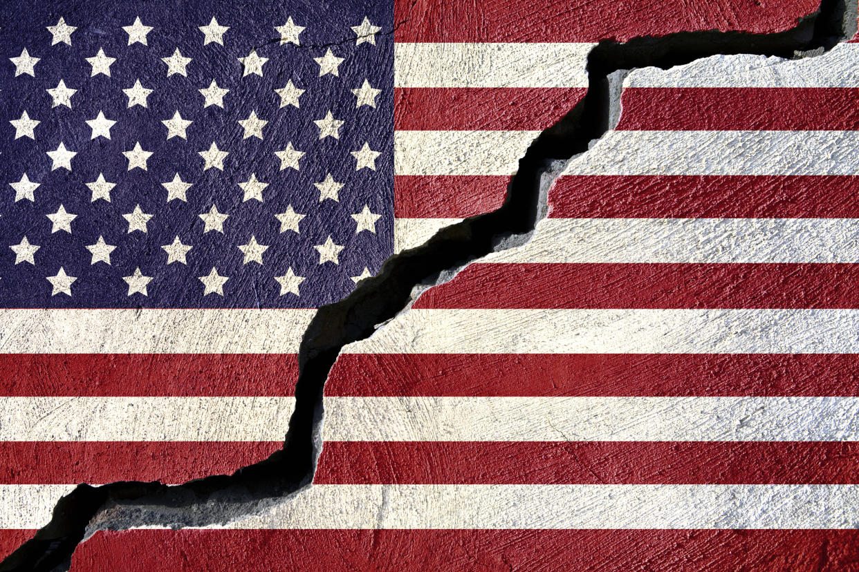 Concept American flag on cracked background