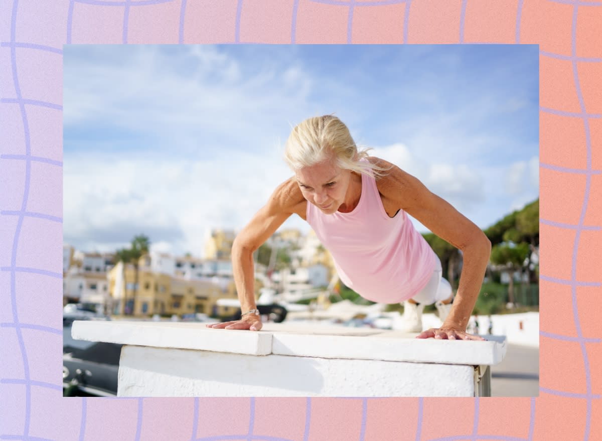 fit, mature woman doing pushups outdoors