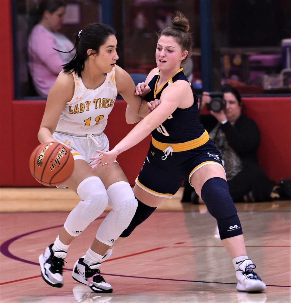 Stephenville's Chandler Glasgow, right, defends against Snyder's Bethany Avalos in the first half.