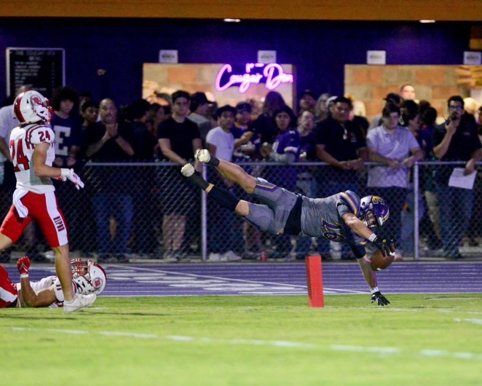 Escalon running back Jamin Miller (26) dives for the endzone during a game between Escalon High School and Ripon High School in Escalon, California on October 20, 2023. 