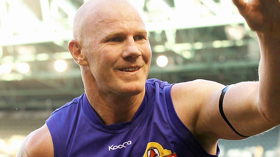 Barry Hall is pictured being chaired off the ground by Western Bulldogs players after his final game in 2011.