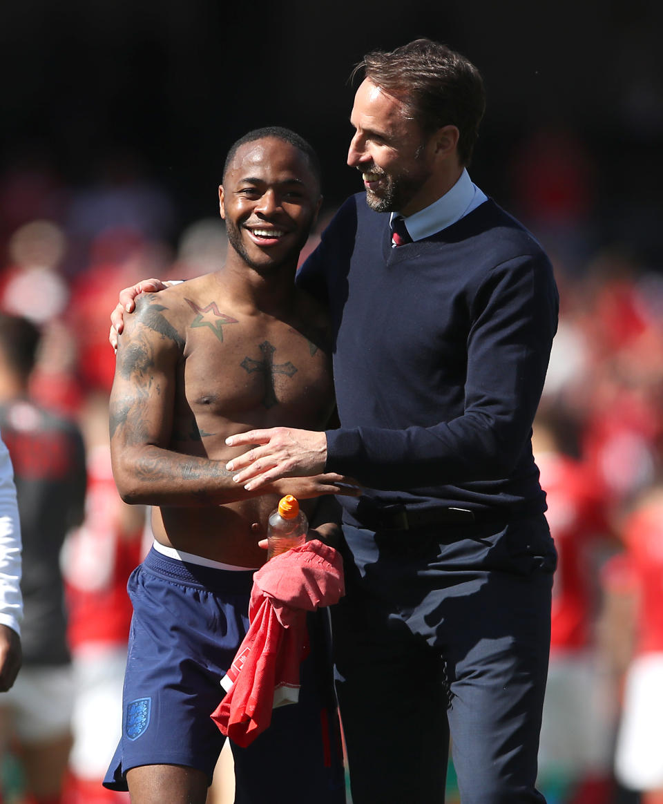 England manager Gareth Southgate (right) celebrates after the final whistle with Raheem Sterling (left) during the Nations League Third Place Play-Off at Estadio D. Alfonso Henriques, Guimaraes.