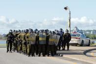 <p>Anti-riot police take positions as protesters march in Quebec City on June 8, 2018, as the G7 Summits gets underway. (Photo: Alice Chiche/AFP/Getty Images) </p>