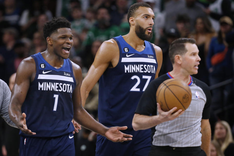 After getting ejected from the game, Minnesota Timberwolves forward Anthony Edwards (1) pleads with referee Brian Forte as center Rudy Gobert (27) walks with them during the fourth quarter of the team's NBA basketball game against the Boston Celtics on Wednesday, March 15, 2023, in Minneapolis. The Celtics won 104-102. (AP Photo/Bruce Kluckhohn)