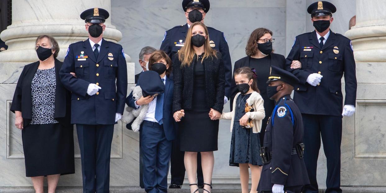 The family of US Capitol Police Officer William Evans looks on as his casket is carried into the U.S. Capitol to lie in honor in the rotunda on April 13, 2021 in Washington, DC.