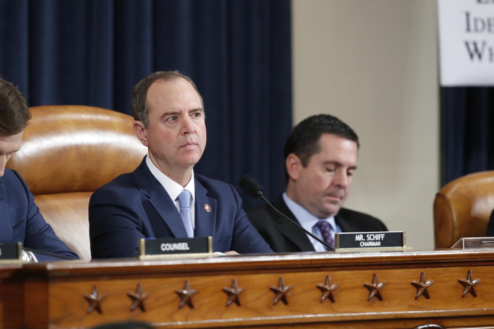 House Intelligence Committee Chairman Adam Schiff, D-Calif., and Rep. Devin Nunes, R-Calif, the ranking member of the House Intelligence Committee, listen to former White House national security aide Fiona Hill, and David Holmes, a U.S. diplomat in Ukraine, testify before the House Intelligence Committee on Capitol Hill in Washington, Thursday, Nov. 21, 2019, during a public impeachment hearing of President Donald Trump's efforts to tie U.S. aid for Ukraine to investigations of his political opponents. (AP Photo/Alex Brandon)