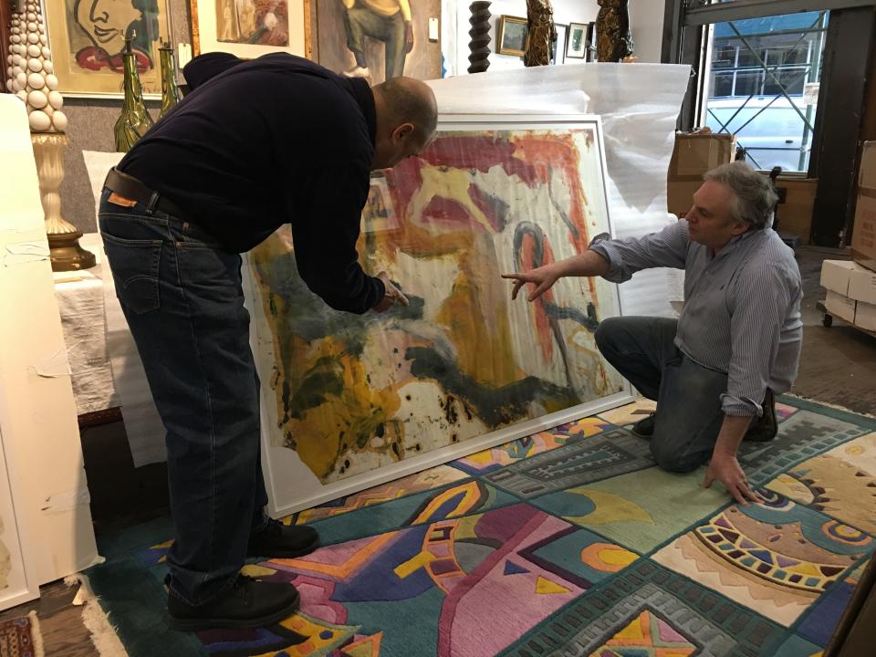 Lawrence Castagna and David Killen admire one of the de Koonings.