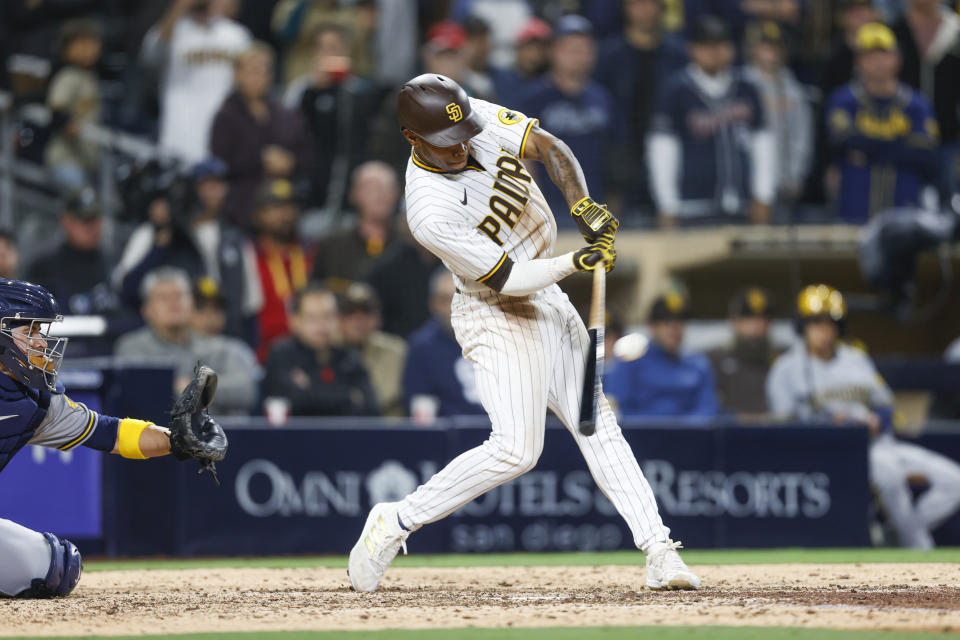 San Diego Padres' Jose Azocar hits a walkoff single to defeat the Milwaukee Brewers 3-2 during the tenth inning of the baseball game Monday, May 23, 2022, in San Diego. (AP Photo/Mike McGinnis)