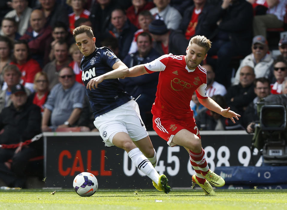 Southampton's Luke Shaw, right, competes for the ball with Manchester United's Adnan Januzaj during their English Premier League soccer match at St Mary's stadium, Southampton, England, Sunday, May 11, 2014. (AP Photo/Sang Tan)