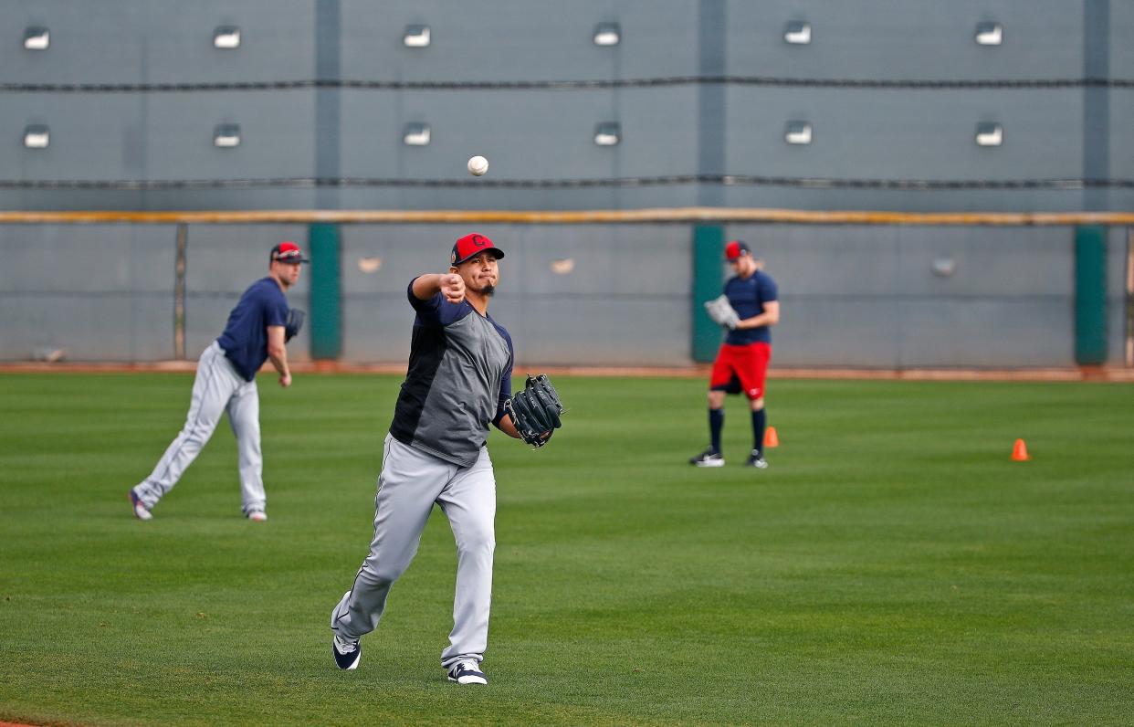 Cleveland pitchers Corey Kluber, left, Carlos Carrasco, middle, and Zach McAllister, right, warm up at spring training on Feb. 13, 2017, in Goodyear, Ariz.