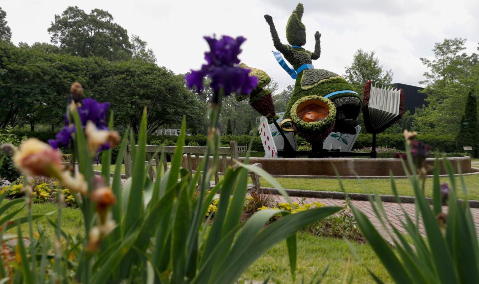 Alice sits in the "Alice's Adventures at the Garden" exhibit on May 10, 2022, at Memphis Botanic Garden. FedEx transported the topiary in the exhibit to Memphis from Atlanta.