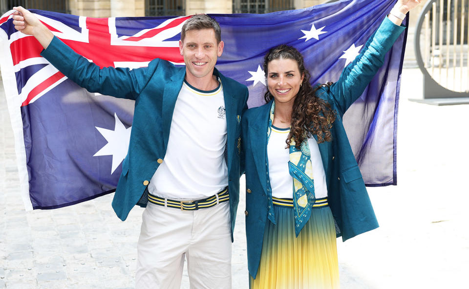 Eddie Ockenden and Jessica Fox with the Australian flag at the Paris Olympics.