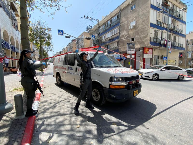 Israeli police let an ambulance pass through the town of Bnei Brak as they enforce a lockdown of the ultra-Orthodox Jewish town badly affected by coronavirus disease (COVID-19), Bnei Brak