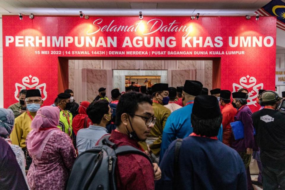 Delegates attend the Umno extraordinary general meeting (EGM)at the World Trade Centre in Kuala Lumpur May 15, 2022. — Picture by Firdaus Latif