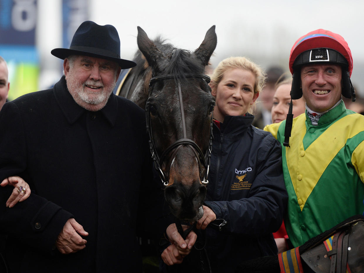 Alan Potts, left, poses with his victorious horse Sizing John and jockey Robbie Power: Getty