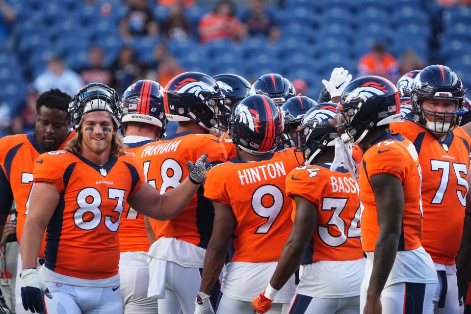 Denver Broncos huddle prior to a preseason game against the Minnesota Vikings at Empower Field at Mile High.