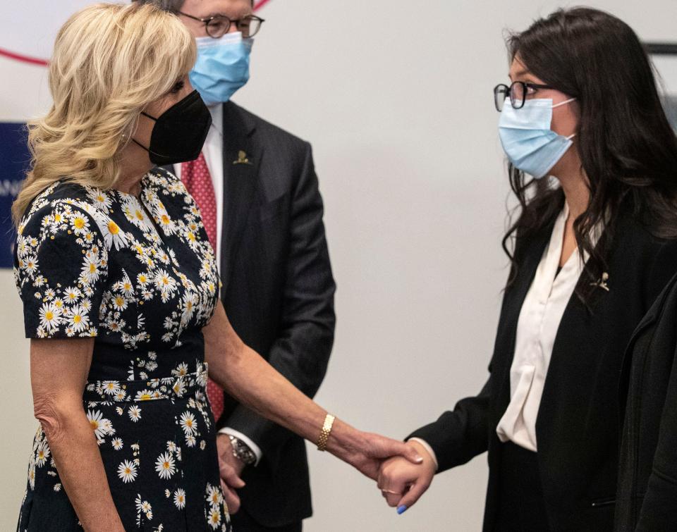 First Lady Jill Biden holds the hands of cancer survivor and St. Jude patient Katherin Aristondo as she tells her story Friday, March 25, 2022, at St. Jude Children's Research Hospital in Memphis.