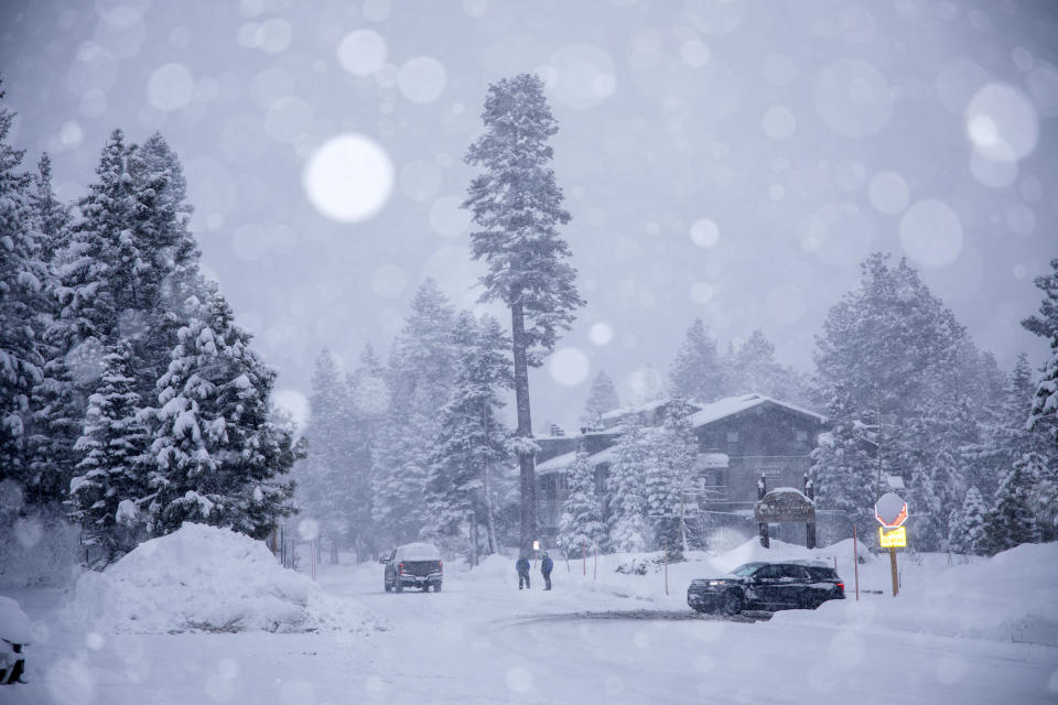 In this photo provided by the Mammoth Mountain Ski Area, cars and buildings are covered in snow in Mammoth Lakes, Calif., on Thursday, Feb. 1, 2024. (Samantha Lindberg/Mammoth Mountain Ski Area via AP)