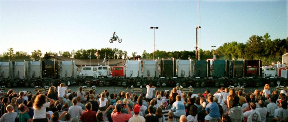 Kaptain Robbie Knievel soars across 17 semitrailer trucks in 1998 in the parking lot at Oneida Casino.