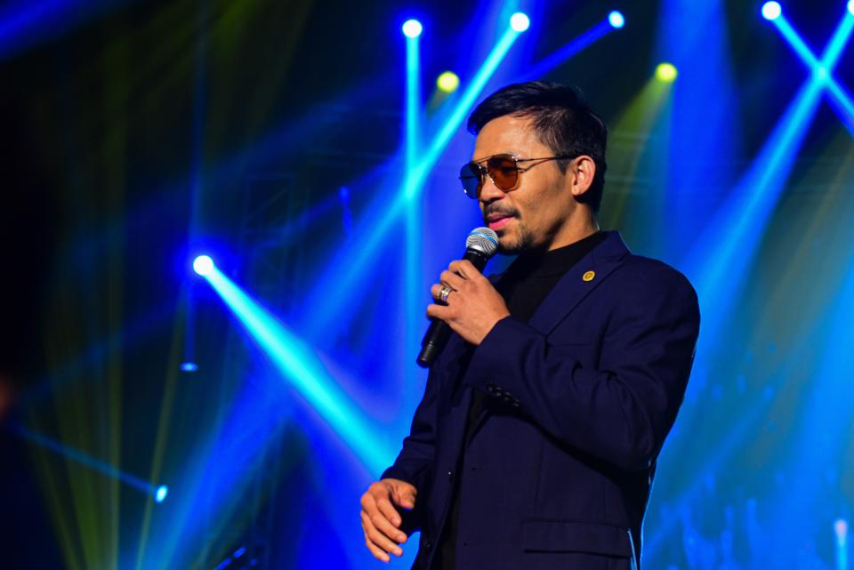 In this photo taken September 1, 2019, Filipino boxing icon Manny Pacquiao performs during a free concert to coincide with the launching of his own cryptocurrency 