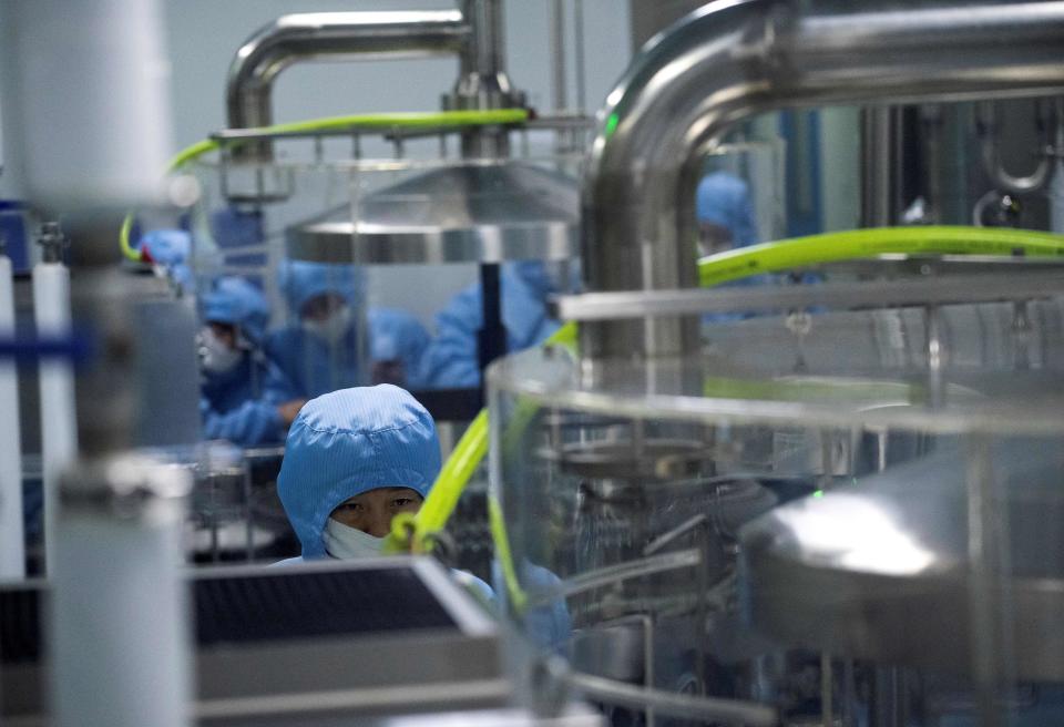 Researchers work in a lab at the Yisheng Biopharma company in Shenyang, in Chinas northeast Liaoning province on June 10, 2020. - The company is one of a number in China trying to develop a vaccine for the COVID-19 coronavirus. (Photo by NOEL CELIS / AFP) (Photo by NOEL CELIS/AFP via Getty Images) ORIG FILE ID: AFP_1T723P